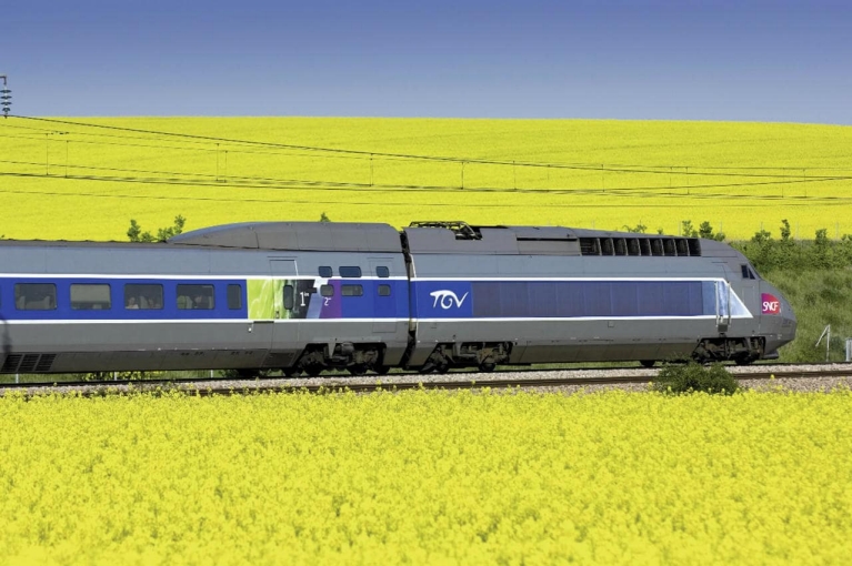 TGV high-speed train crossing fields in France