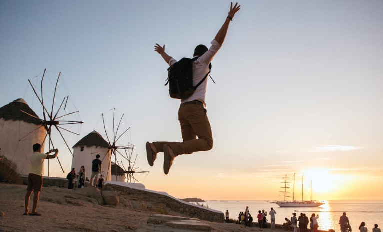 young_man_jumping_on_beach